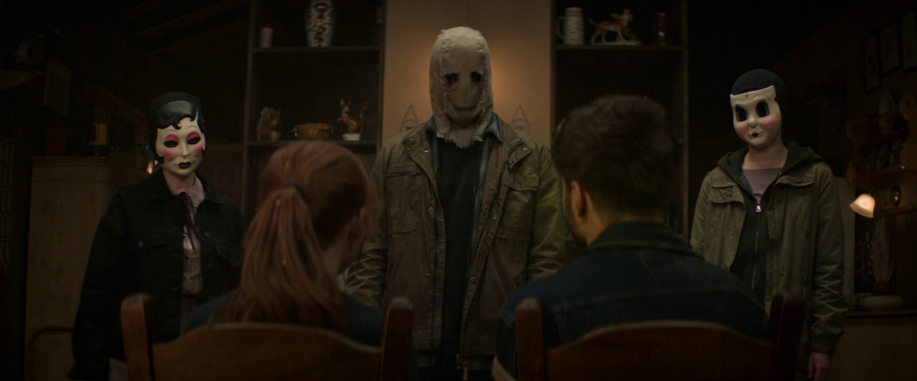 The three masked Strangers from The Strangers Trilogy: Dollface, Pin-Up Girl and Scarecrow