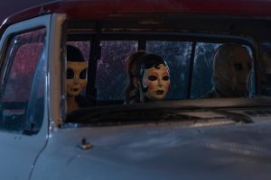 Madelaine Petsch as Maya, Ella Bruccoleri as Dollface, and Gabriel Basso as Gregory in The Strangers - Chapter 3. Photo Credit: Jordy Clarke/Lionsgate